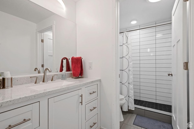 2076 E Granite Ln N Unit 145, Eagle Mountain, UT 84005 - full bathroom with vanity, toilet, tiled shower, and tile patterned floors