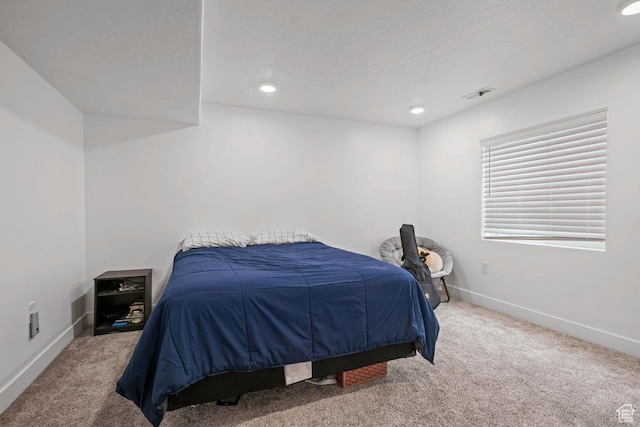 2076 E Granite Ln N Unit 145, Eagle Mountain, UT 84005 - carpeted bedroom featuring baseboards, recessed lighting, and a textured ceiling