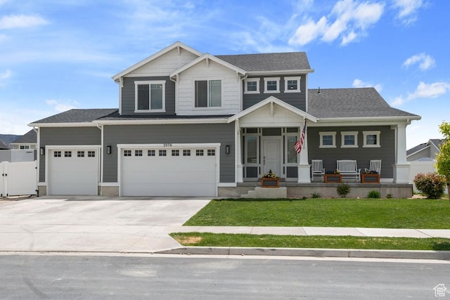 2076 E Granite Ln N Unit 145, Eagle Mountain, UT 84005 - craftsman house with covered porch, concrete driveway, a garage, and roof with shingles