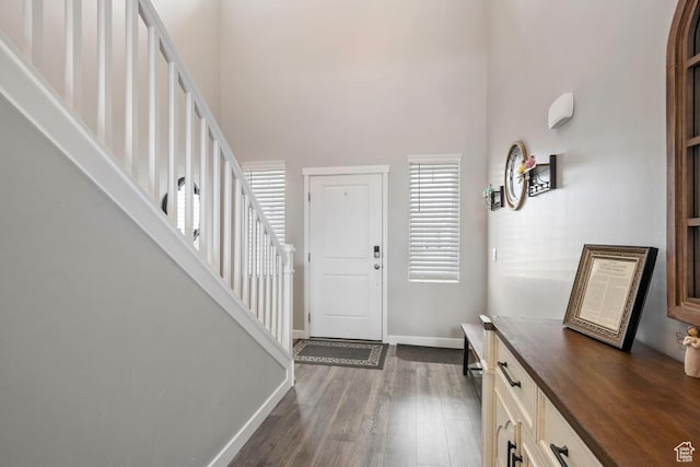 2076 E Granite Ln N Unit 145, Eagle Mountain, UT 84005 - entrance foyer with stairs, dark wood finished floors, baseboards, and a towering ceiling