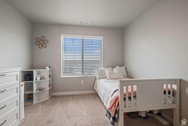 2076 E Granite Ln N Unit 145, Eagle Mountain, UT 84005 - bedroom featuring baseboards and light carpet
