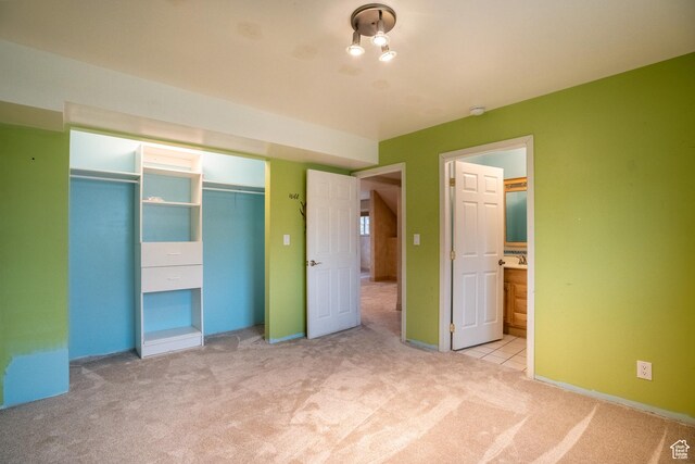2215 W 800 N, West Point, UT 84015 - unfurnished bedroom with carpet floors, a closet, connected bathroom, and baseboards