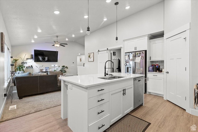 464 S Trejo Ridge Rd, Grantsville, UT 84029 - kitchen with a sink, dishwasher, light wood finished floors, lofted ceiling, and a ceiling fan