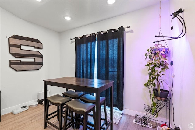 464 S Trejo Ridge Rd, Grantsville, UT 84029 - dining space featuring wood finished floors, baseboards, and recessed lighting