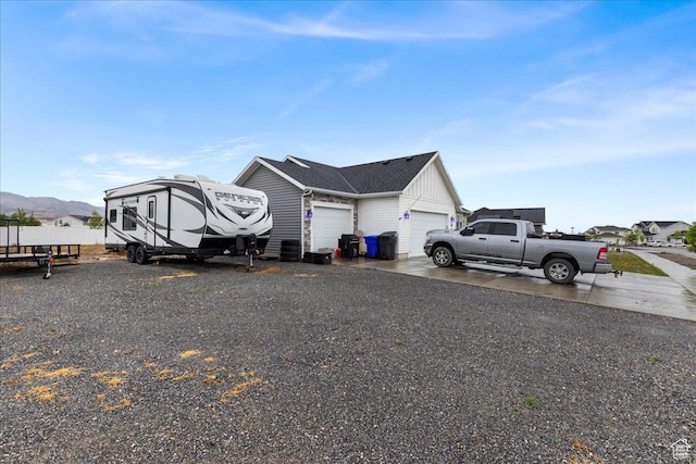464 S Trejo Ridge Rd, Grantsville, UT 84029 - view of property exterior with a garage, board and batten siding, and driveway