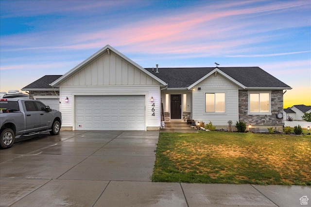 464 S Trejo Ridge Rd, Grantsville, UT 84029 - single story home featuring a garage, concrete driveway, a front lawn, board and batten siding, and stone siding