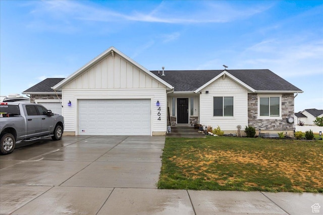 464 S Trejo Ridge Rd, Grantsville, UT 84029 - single story home with concrete driveway, an attached garage, a front yard, stone siding, and board and batten siding