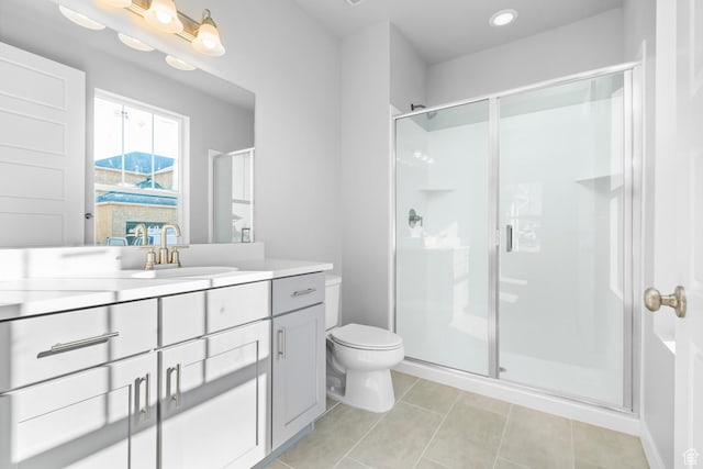 9806 N Willowbank Dr, Highland, UT 84003 - full bath with vanity, a stall shower, toilet, and tile patterned floors
