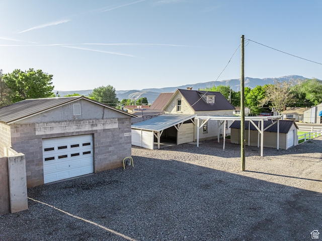 509 E 300 N, Richfield, UT 84701 - view of front facade with an outbuilding, a mountain view, and a garage