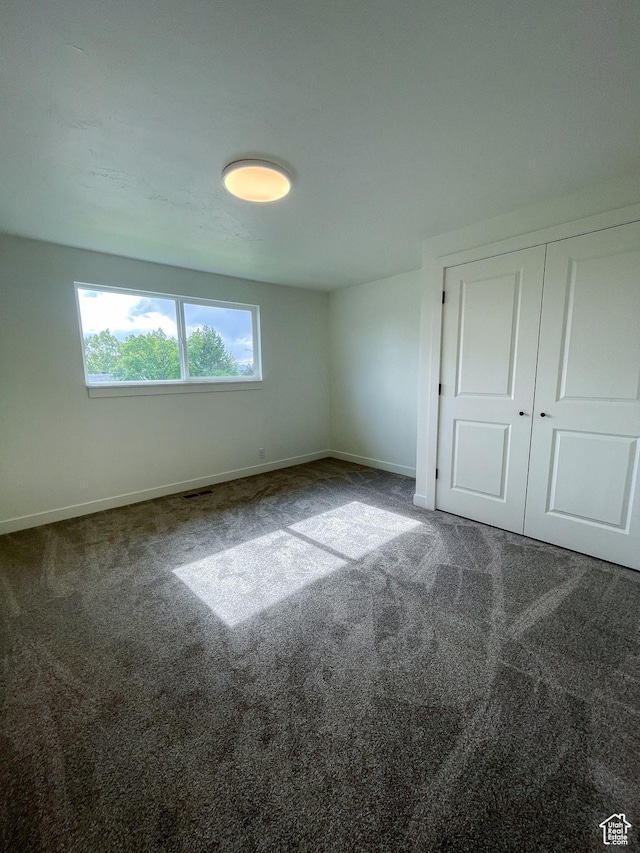 685 S Idaho Ave E, Provo, UT 84606 - unfurnished bedroom with baseboards, carpet, and a closet
