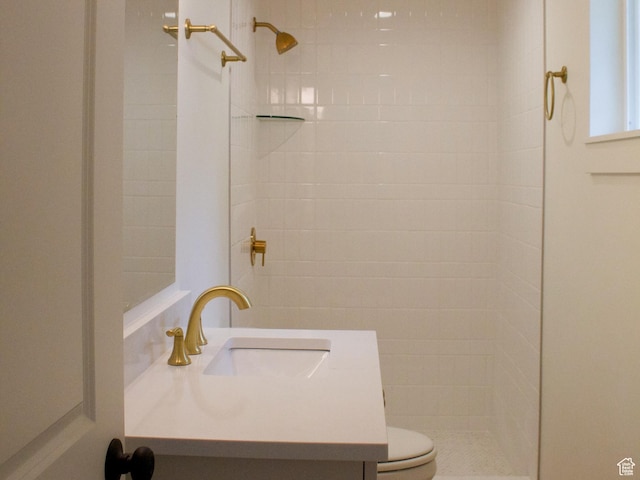685 S Idaho Ave E, Provo, UT 84606 - full bathroom featuring a tile shower, vanity, and toilet