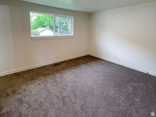 685 S Idaho Ave E, Provo, UT 84606 - empty room with baseboards and dark colored carpet