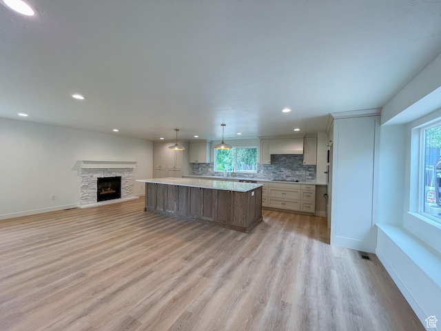 685 S Idaho Ave E, Provo, UT 84606 - kitchen featuring open floor plan, a kitchen island, light countertops, light wood-style floors, and recessed lighting