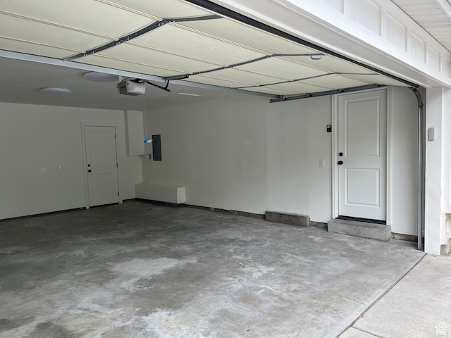 685 S Idaho Ave E, Provo, UT 84606 - garage featuring a garage door opener and electric panel