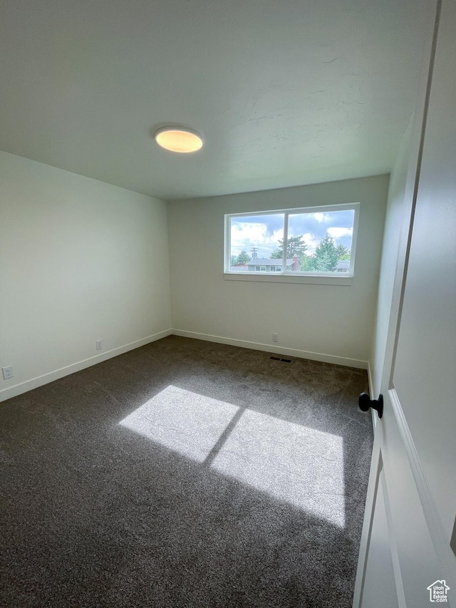 685 S Idaho Ave E, Provo, UT 84606 - empty room featuring dark carpet and baseboards