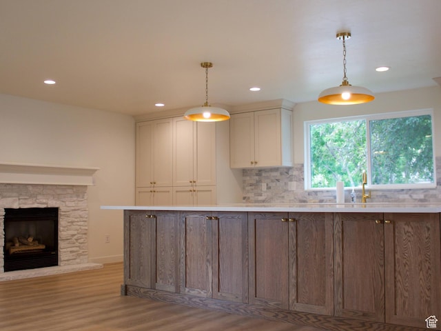 685 S Idaho Ave E, Provo, UT 84606 - kitchen with light wood-style floors, recessed lighting, hanging light fixtures, and light countertops