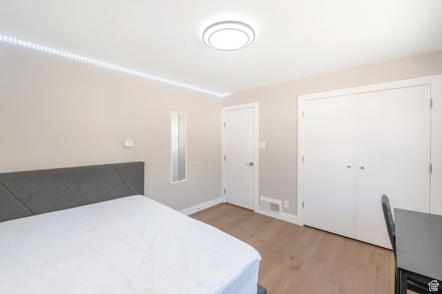 561 N 700 E, Provo, UT 84606 - bedroom with light wood-style floors, baseboards, and a closet