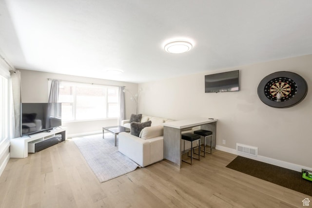 561 N 700 E, Provo, UT 84606 - living room featuring plenty of natural light, wood finished floors, and baseboards