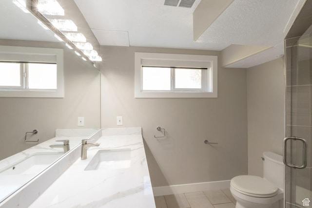561 N 700 E, Provo, UT 84606 - bathroom with toilet, vanity, baseboards, a shower with door, and tile patterned flooring