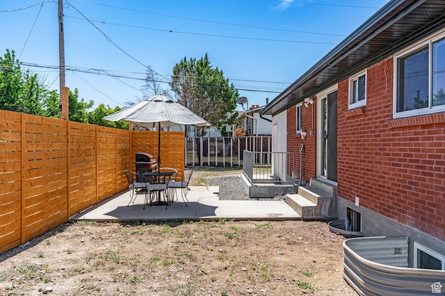 3649 S Hawkeye St, West Valley City, UT 84120 - fenced backyard with a patio and entry steps
