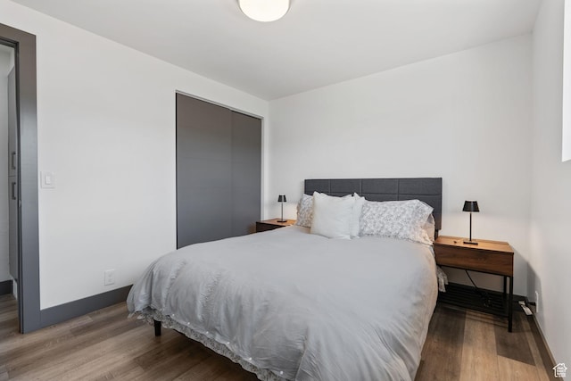 3649 S Hawkeye St, West Valley City, UT 84120 - bedroom with wood finished floors, a closet, and baseboards