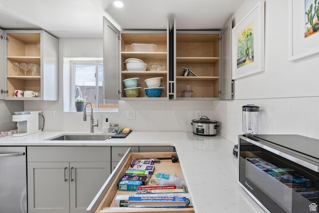 3649 S Hawkeye St, West Valley City, UT 84120 - kitchen with a sink, stainless steel appliances, open shelves, and light countertops