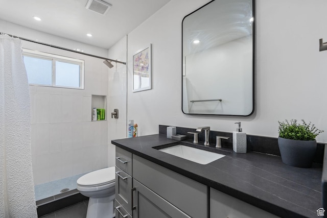 3649 S Hawkeye St, West Valley City, UT 84120 - full bathroom featuring toilet, vanity, tiled shower, and recessed lighting