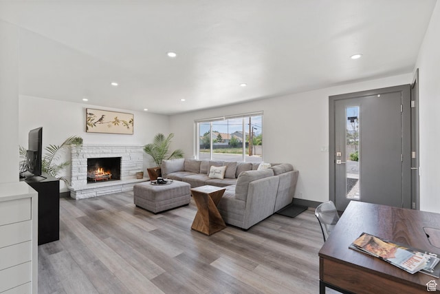 3649 S Hawkeye St, West Valley City, UT 84120 - living area with light wood-style floors, recessed lighting, and a fireplace