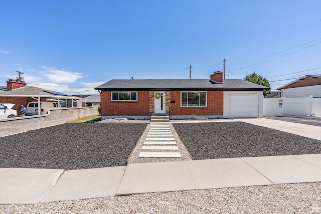 3649 S Hawkeye St, West Valley City, UT 84120 - single story home featuring concrete driveway, brick siding, an attached garage, and a chimney