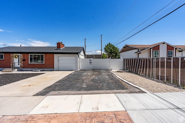 3649 S Hawkeye St, West Valley City, UT 84120 - view of front of home with a garage, brick siding, driveway, a chimney, and a shingled roof