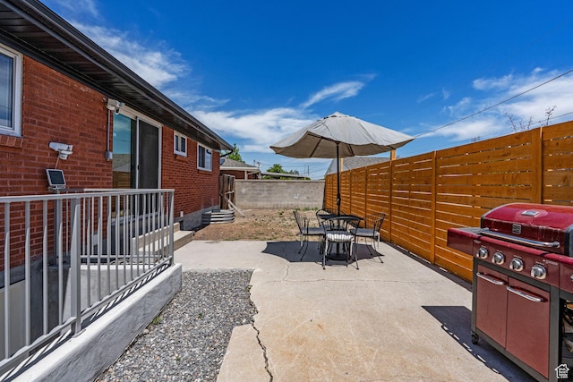 3649 S Hawkeye St, West Valley City, UT 84120 - view of patio / terrace with entry steps, outdoor dining area, and grilling area