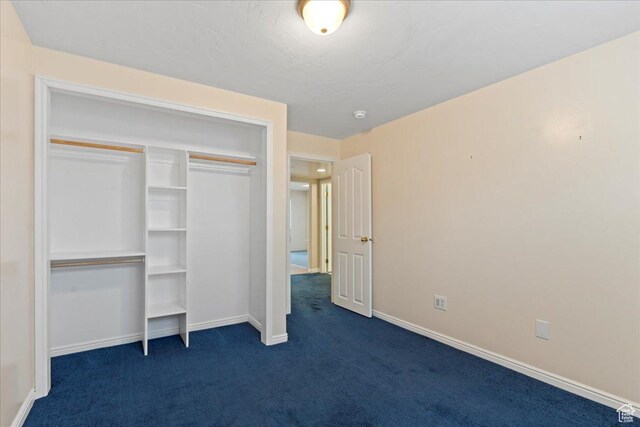 2718 W Southpointe Rd, South Jordan, UT 84095 - unfurnished bedroom featuring dark carpet, baseboards, and a closet