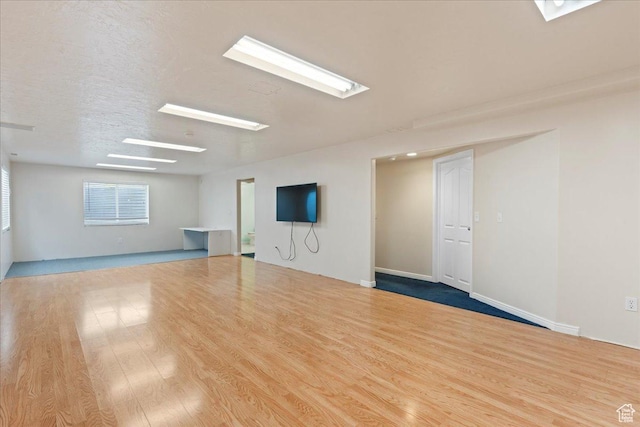 2718 W Southpointe Rd, South Jordan, UT 84095 - empty room with wood finished floors and a skylight