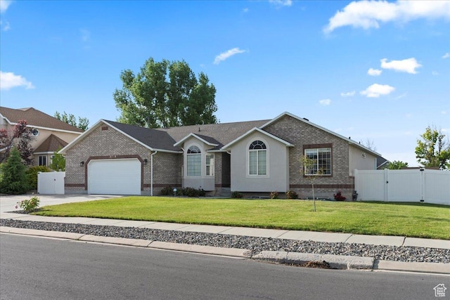 2718 W Southpointe Rd, South Jordan, UT 84095 - single story home featuring a gate, brick siding, a garage, and concrete driveway