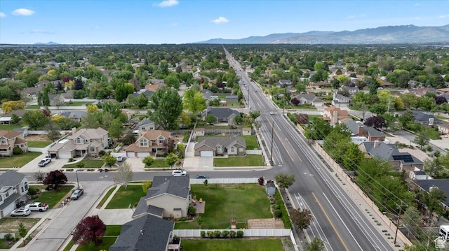 2718 W Southpointe Rd, South Jordan, UT 84095 - aerial perspective of suburban area featuring a mountainous background and a highway