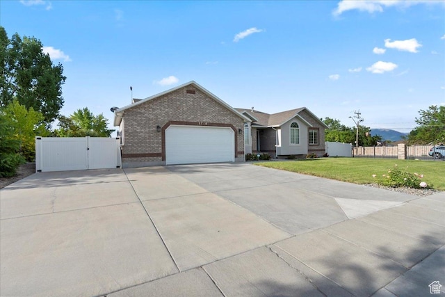 2718 W Southpointe Rd, South Jordan, UT 84095 - single story home with a gate, concrete driveway, brick siding, and a garage
