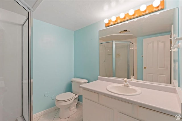 2718 W Southpointe Rd, South Jordan, UT 84095 - bathroom with a shower stall, tile patterned flooring, vanity, toilet, and baseboards