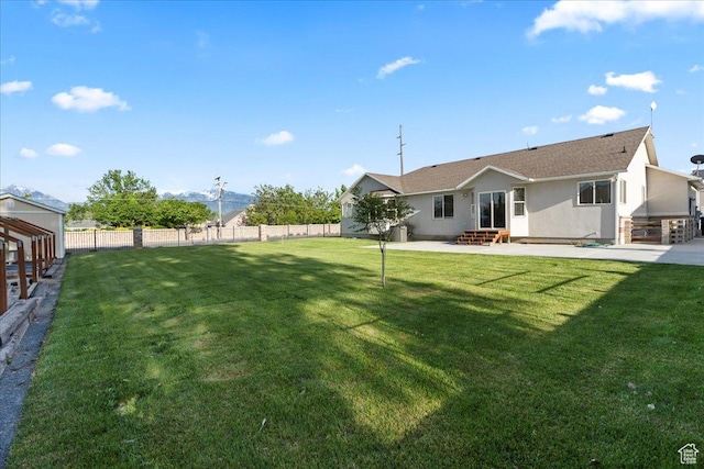 2718 W Southpointe Rd, South Jordan, UT 84095 - back of property featuring entry steps, a patio area, stucco siding, and roof with shingles