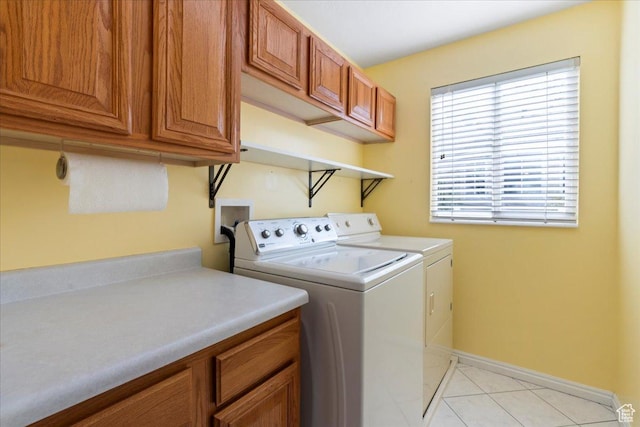 2718 W Southpointe Rd, South Jordan, UT 84095 - laundry room featuring washer and dryer, cabinet space, baseboards, and light tile patterned floors
