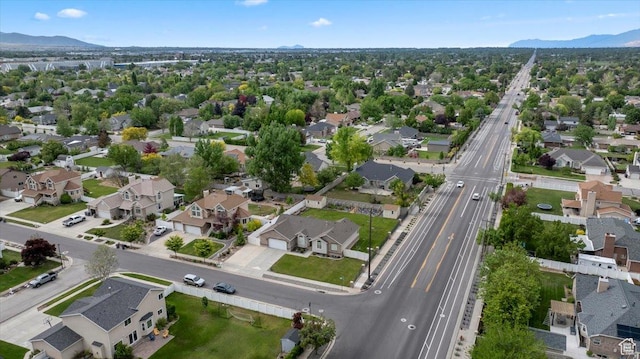2718 W Southpointe Rd, South Jordan, UT 84095 - aerial overview of property's location with a mountainous background, a highway, and nearby suburban area