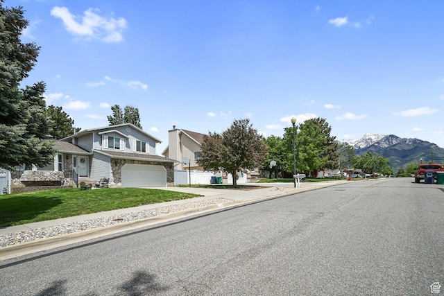 1213 E Earl Way S, Sandy, UT 84094 - view of asphalt street featuring sidewalks, street lighting, a mountain view, and curbs