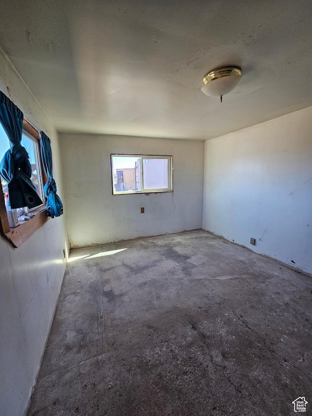 44600 W Hwy 40, Fruitland, UT 84027 - spare room with plenty of natural light and concrete floors
