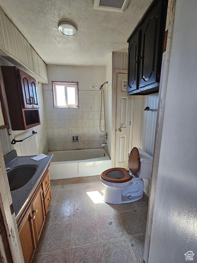 44600 W Hwy 40, Fruitland, UT 84027 - full bath with toilet, bathing tub / shower combination, vanity, and a textured ceiling