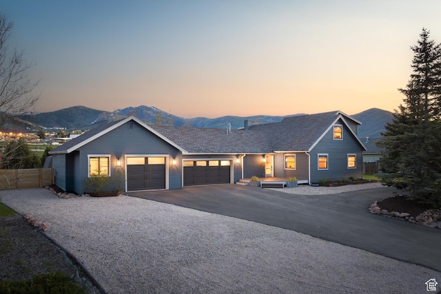 1753 Teal Dr, Kimball Junction, UT 84098 - view of front of home featuring a garage, a mountain view, and asphalt driveway