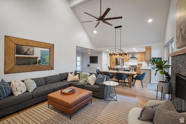1753 Teal Dr, Kimball Junction, UT 84098 - living area featuring high vaulted ceiling, light wood-type flooring, ceiling fan, a chandelier, and recessed lighting