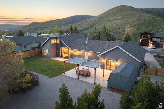 1753 Teal Dr, Kimball Junction, UT 84098 - back of property featuring a mountain view, a patio area, and outdoor dining space