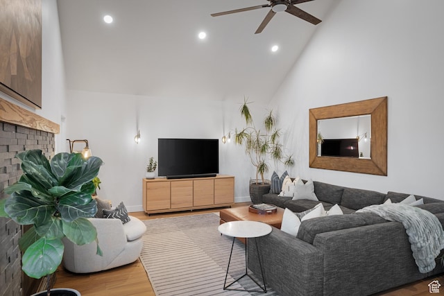 1753 Teal Dr, Kimball Junction, UT 84098 - living area with ceiling fan, wood finished floors, a fireplace, high vaulted ceiling, and recessed lighting