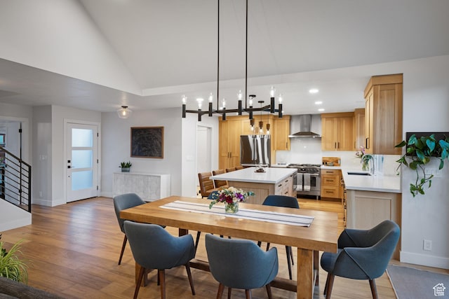 1753 Teal Dr, Kimball Junction, UT 84098 - dining area with light wood-style floors, vaulted ceiling, baseboards, recessed lighting, and stairs