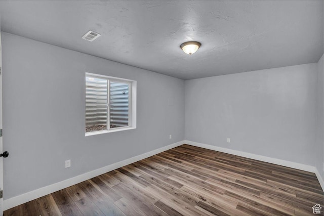 1038 S 4575 W, Cedar City, UT 84720 - spare room with wood finished floors and baseboards