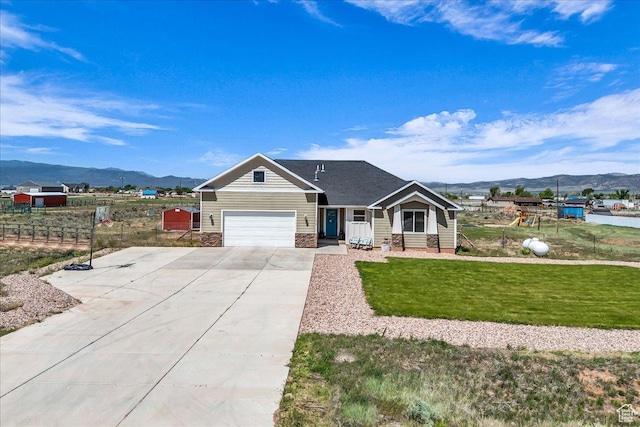 1038 S 4575 W, Cedar City, UT 84720 - view of front of house with a mountain view, driveway, and an attached garage